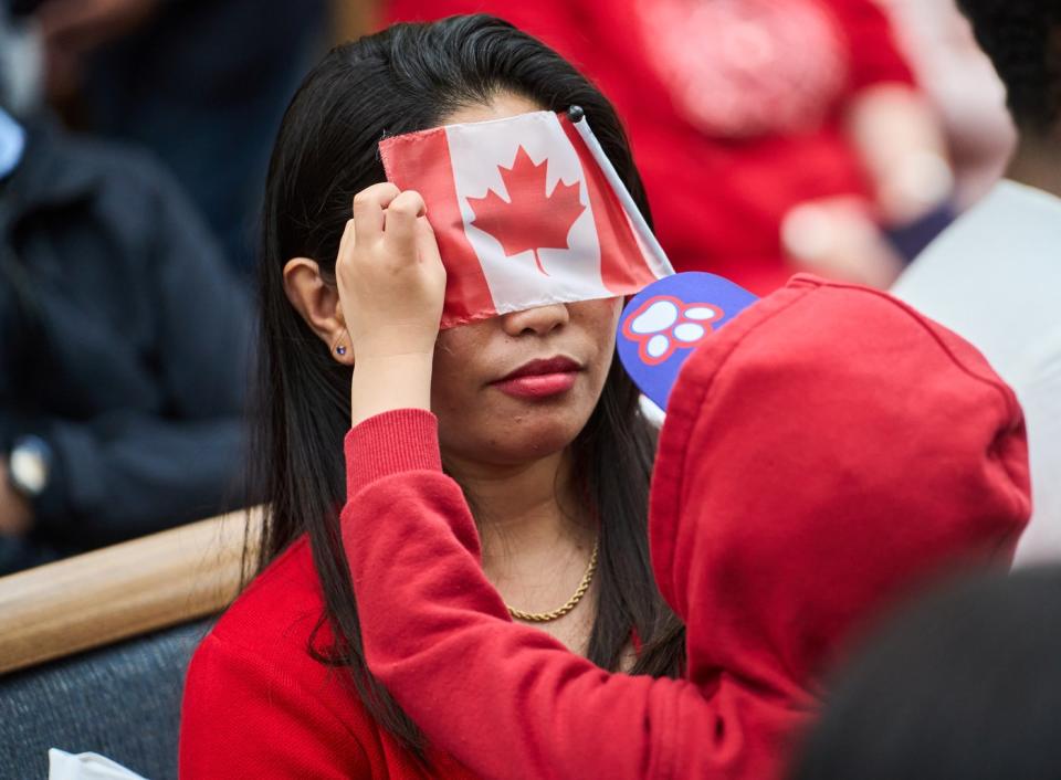 Photo Gallery: Canadians in a sea of red celebrate Canada Day at various events in cities and towns across the country.