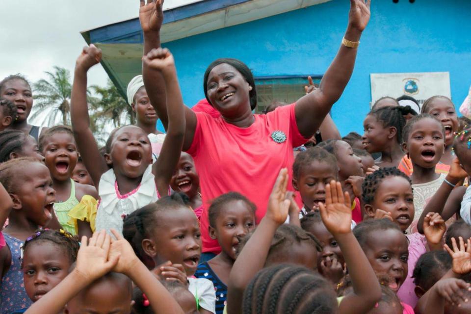 Alice Sumo surrounded by girls named after her at White Plains clinic (Hannah Adcock/Save the Children)