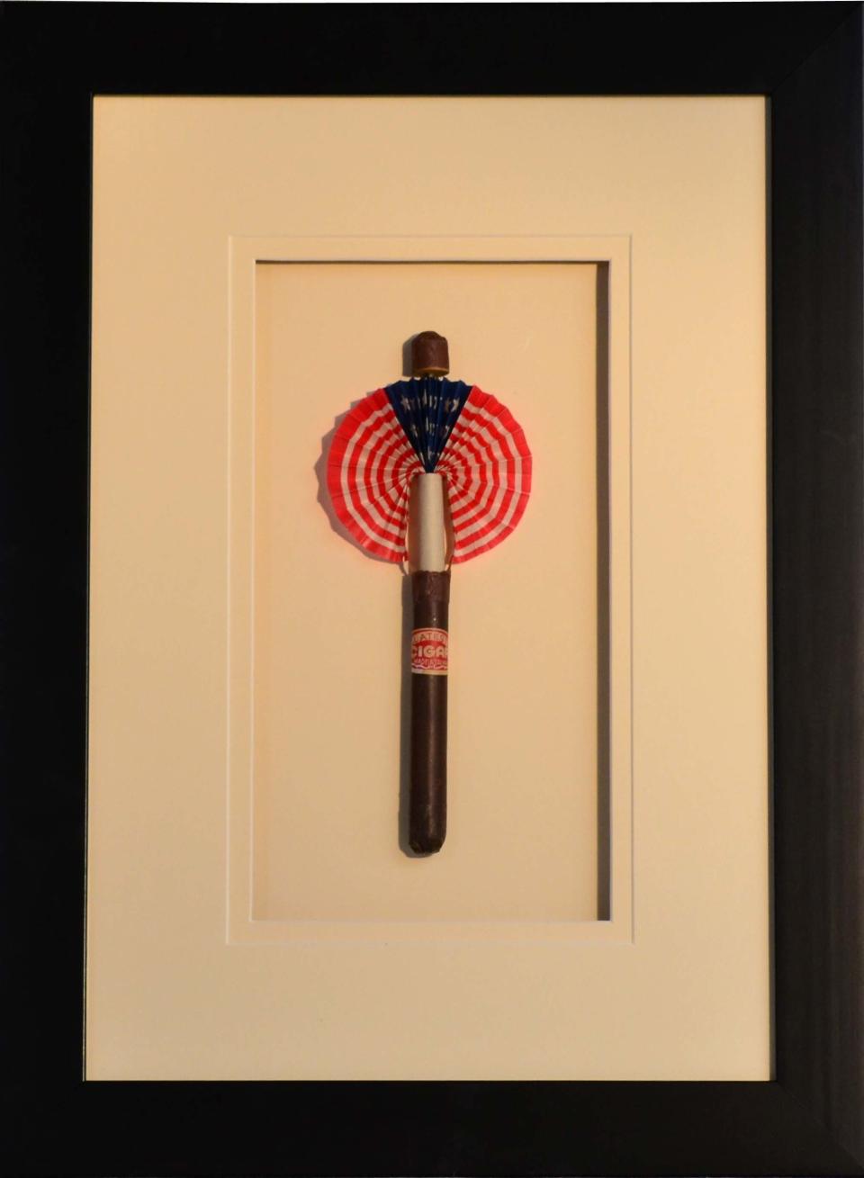 Vintage paper cigar given out at a National Presidential Convention in celebration. Very few have survived. Archivally framed. Cigar fan, 4"W x 9"H.  <strong>From</strong>: <a href="https://www.onekingslane.com/sales/20059?utm_source=HuffPo&utm_medium=display&utm_content=HuffPO&utm_campaign=flags" target="_blank">One Kings Lane</a>