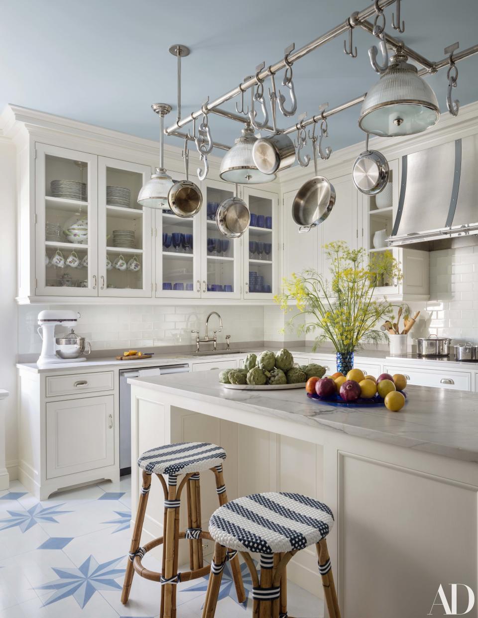 Benjamin Moore's Breath of Fresh Air paint brightens up the kitchen ceiling. Ann-Morris pot rack.