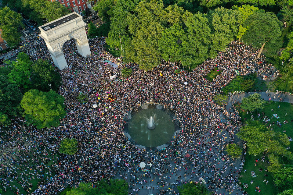 A massive crowd of people in the park