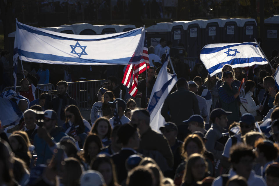 Supporters hold Israeli and American flags as they gather on the National Mall at the March for Israel on Tuesday, Nov. 14, 2023, in Washington. (AP Photo/Mark Schiefelbein)