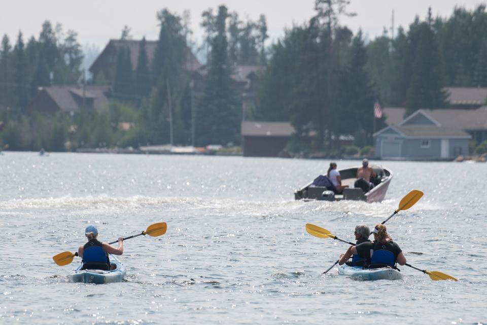 Kayaking and boating on the water in Grand Lake