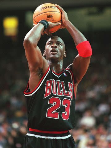 <p>Alexander Hassenstein/Bongarts/Getty</p> Michael Jordan in 1997