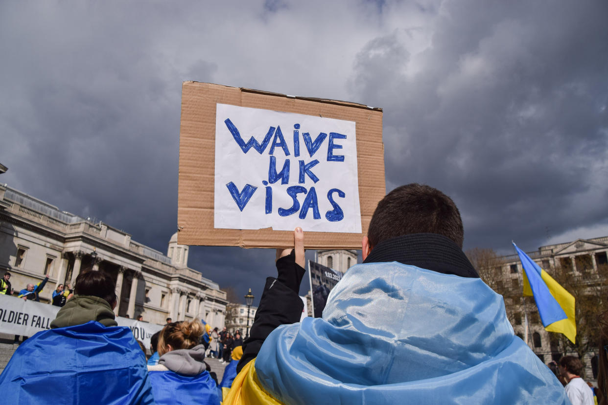 LONDON, UNITED KINGDOM - 2022/04/02: A protester holds a &#39;Waive UK Visas&#39; placard in support of refugees during the pro-Ukraine rally in Trafalgar Square. Protesters continue to gather in central London in solidarity with Ukraine, as Russia intensifies its attack. (Photo by Vuk Valcic/SOPA Images/LightRocket via Getty Images)