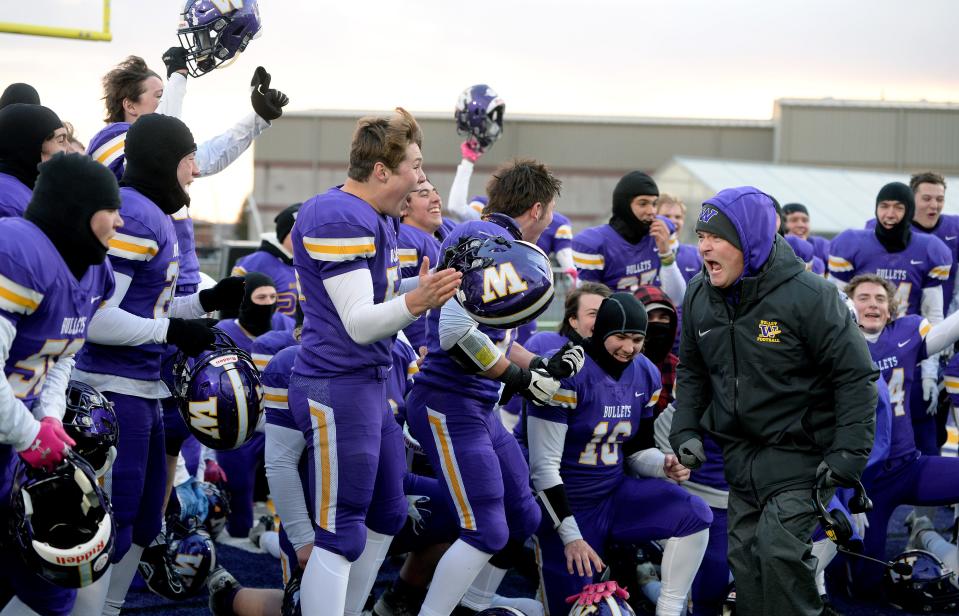 Williamsville's Head Coach Aaron Kunz, right, celebrates with his team after winning the semi-final against Tolono Unity Saturday Nov. 11, 2022.