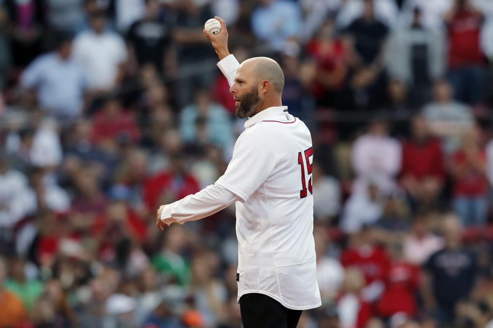 Former Boston Red Sox's Dustin Pedroia prepares to throw out the ceremonial first pitch before a baseball game against the New York Yankees, Friday, June 25, 2021, in Boston. (AP Photo/Michael Dwyer)