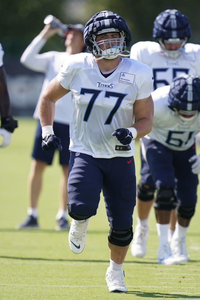 Pro Bowl left tackle Taylor Lewan reports for Titans camp