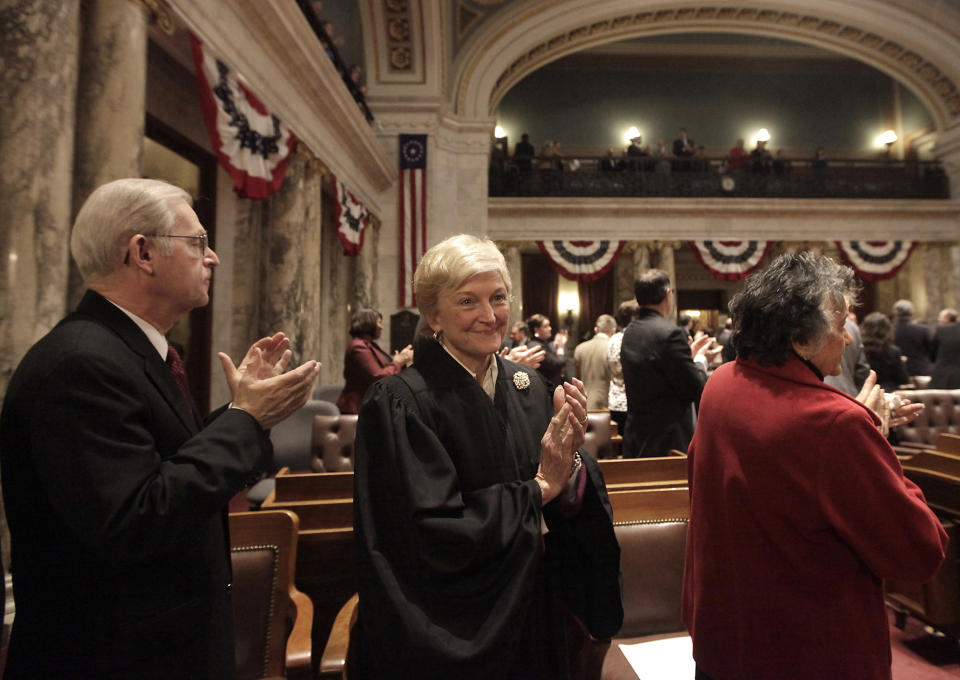 FILE - Members of the Wisconsin State Supreme Court, including Justice David Prosser, Jr., left, Justice Patience Roggensack, center, and Chief Justice Shirley Abrahamson, right, gather for Governor Scott Walker's state budget address at the Wisconsin State Capitol in Madison, Wis. Wednesday, Feb. 20, 2013. A Wisconsin judge on Friday, Nov. 10 ordered the former chief justice of the Wisconsin Supreme Court to produce records related to her work advising the Republican Assembly speaker on whether to impeach a current justice.(AP Photo/Wisconsin State Journal, John Hart, File)