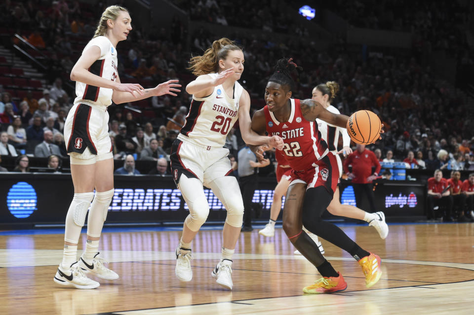 North Carolina State guard Saniya Rivers (22) drives to the basket as Stanford guard Elena Bosgana (20) defends during the first half of a Sweet 16 college basketball game in the women's NCAA Tournament, Friday, March 29, 2024, in Portland, Ore. (AP Photo/Steve Dykes)
