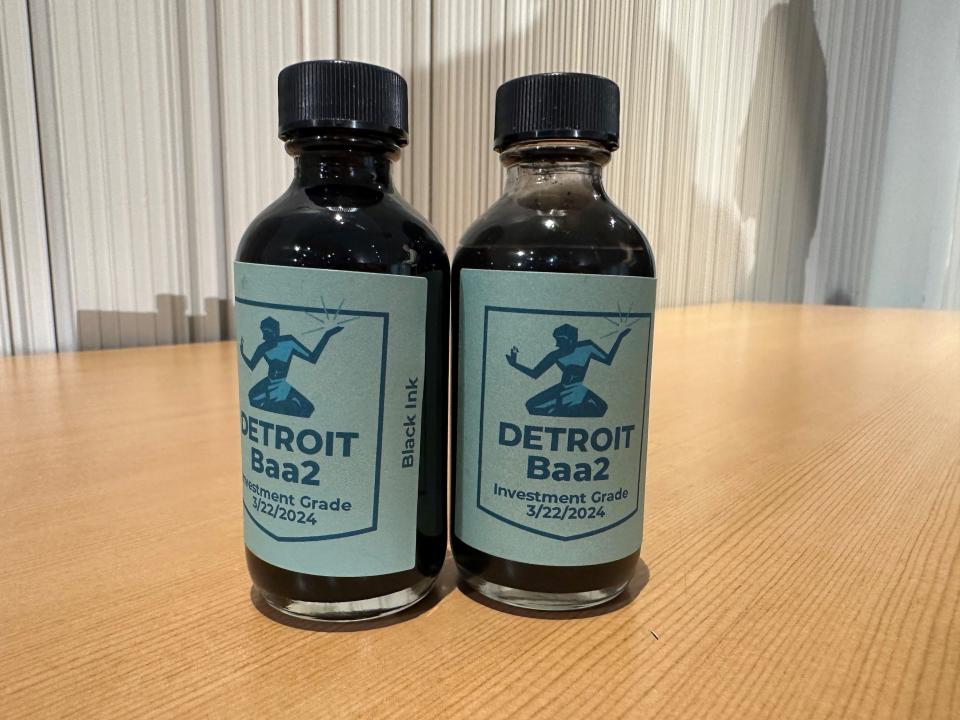 Mayor Mike Duggan handed out bottles of black ink to his cabinet members to celebrate the city's return to investment grade credit rating on Monday, March 25, 2024 at the Detroit Public Safety Headquarters.