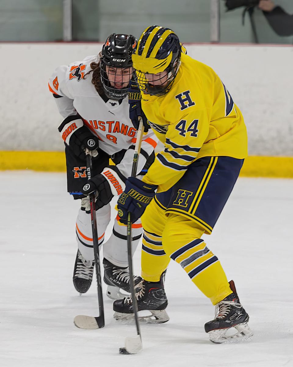 Hartland's Eli Sturos shoots the puck while defended by Northville's Cole Lefere during the Eagles' 6-1 victory on Wednesday, Jan. 4, 2023 at Hartland Sports Center.