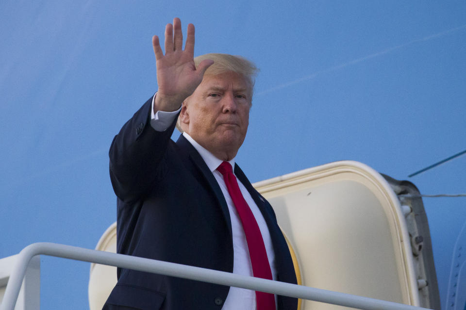 President Donald Trump waves as he boards Air Force One to depart Cleveland-Hopkins International Airport, Friday, July 12, 2019, in Cleveland. (AP Photo/Alex Brandon)