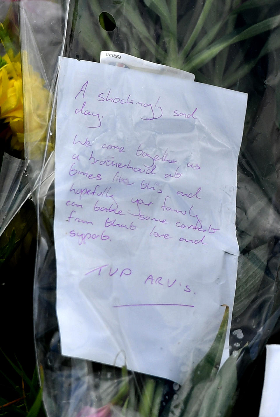 A message from officers of the Thames Valley Police armed response vehicles unit on a floral tribute at the scene, where Thames Valley Police officer Pc Andrew Harper, 28, died following a "serious incident" at about 11.30pm on Thursday near the A4 Bath Road, between Reading and Newbury, at the village of Sulhamstead in Berkshire.