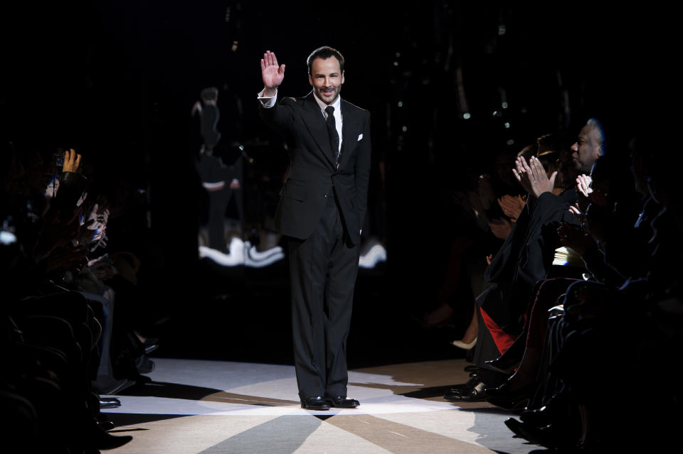 U.S fashion designer Tom Ford waves during his show at London Fashion Week, Monday, Feb. 18, 2013, London. (Photo by Jonathan Short/Invision/AP)