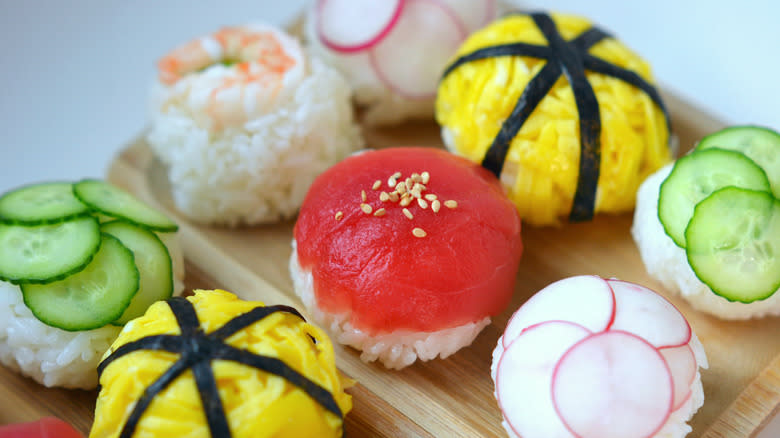 Colorful temarizushi on wooden plates