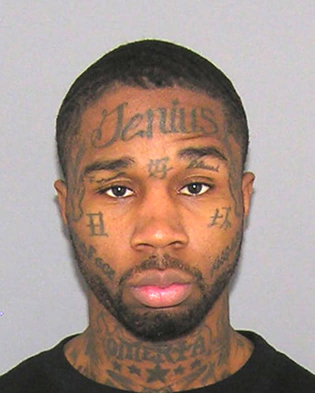 Jerome Smith, 27, from Ohio, America has 'Genius' (spelled with a J) tattooed on his forehead. The 'Jenius' criminal was arrested for battery (Rex Features)