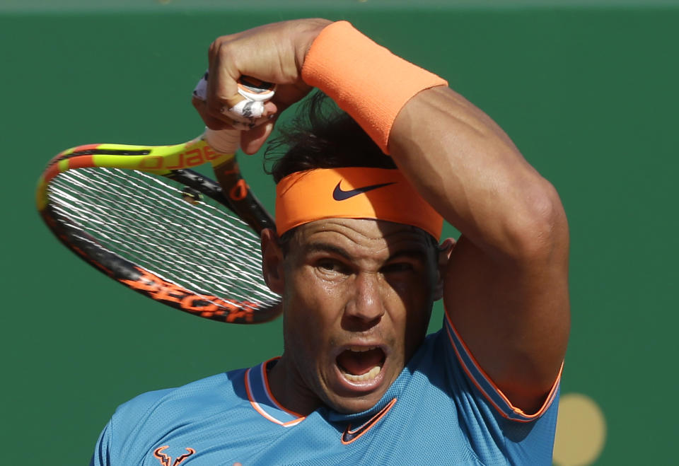 FILE - In this April 19, 2019, file photo, Spain's Rafael Nadal returns the ball to Argentina's Guido Pella during their quarterfinal match of the Monte Carlo Tennis Masters tournament in Monaco. Every other player in the men’s bracket will be pursuing Nadal as the 34-year-old from Spain pursues history at the French Open that starts Sunday, Sept. 27, 2020.(AP Photo/Claude Paris, File)