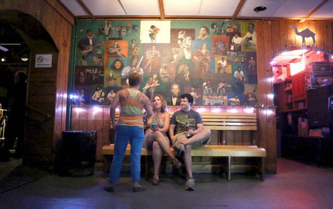 Amber Inscoe, of Wilson, and Jamie Proctor, of Raleigh, sit and have a drink before watching Southern Culture on the Skids at Berkeley Cafe on its last night of the music hall being open on Saturday, June 29, 2013.