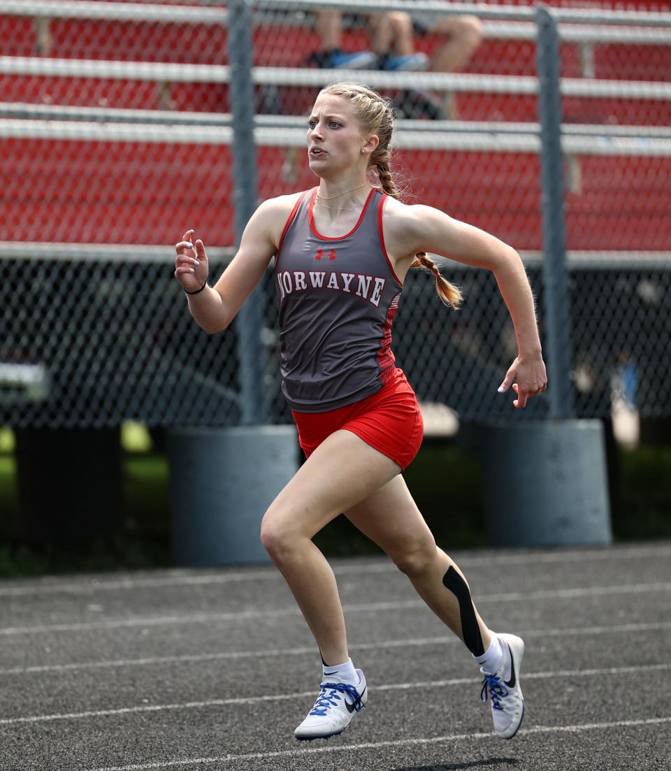 Norwayne's Lacy Hess sprints to the finish line to win the 400 and qualify for regionals at the Div. II Orrville District.
