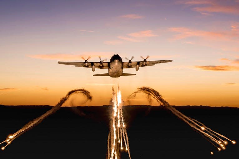 A Wyoming Air National Guard C-130 fires off flares over Camp Guernsey Joint Training Center, Wyo., Sept. 24, 2019, during a training mission.