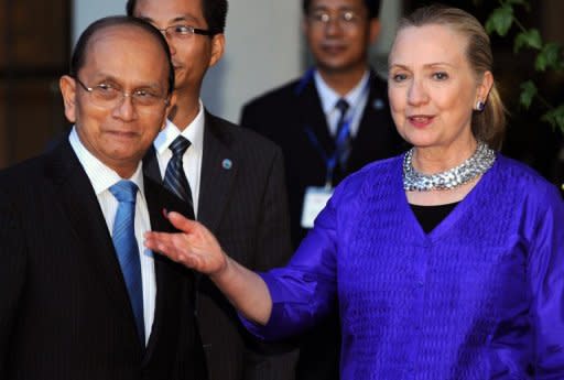 US Secretary of State Hillary Clinton welcomes Myanmar President Thein Sein before a meeting in Siem Reap, on July 13. Clinton flew out of Asia on Saturday after a trip dominated by significantly warmer ties with Myanmar as Washington looks to open the resource-rich former pariah to US firms