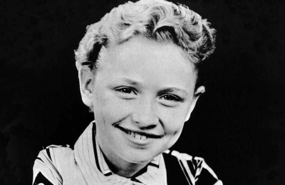 Dolly Rebecca Parton was born on 19 January 1946 in a one-room cabin on the banks of the Little Pigeon River in Pittman Center, Tennessee, arriving as the fourth of 12 children. Dolly later described her family as being "dirt poor" and often addressed her upbringing in hits such as 'Coat of Many Colors'. The family lived in the one bedroom cabin until Dolly was about six or seven and by her early teens, she was performing on local television after teaching herself to play a homemade guitar. Dolly decided to kickstart her career in music when she had a chance meeting with Johnny Cash and he told her to "follow her instincts".