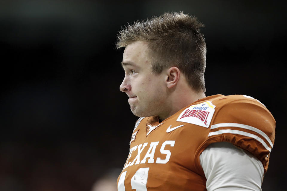 Sam Ehlinger has shown development as a passer each season for Texas, but he still has work to do to boost his draft stock. (Photo by Tim Warner/Getty Images)