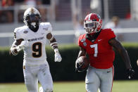 Georgia running back D'Andre Swift (7) runs as Murray State defensive back Dior Johnson (9) pursues In the first half of an NCAA college football game Saturday, Sept. 7, 2019, in Athens, Ga. (AP Photo/John Bazemore)