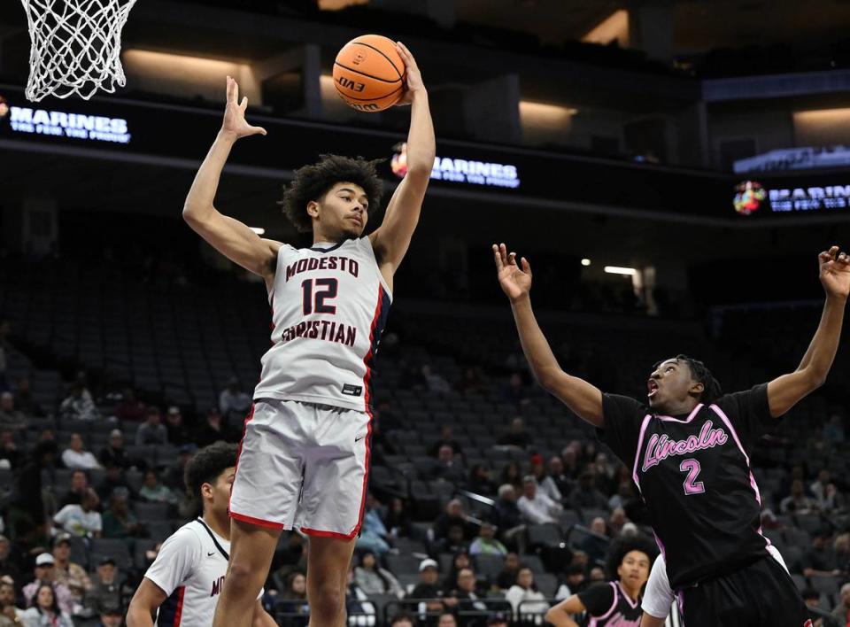 Modesto Christian’s Marcus Washington grabs a rebound during the Sac-Joaquin Section Division I championship game with Lincoln of Stockton at the Golden 1 Center in Sacramento, Calif., Wednesday, Feb. 21, 2024.