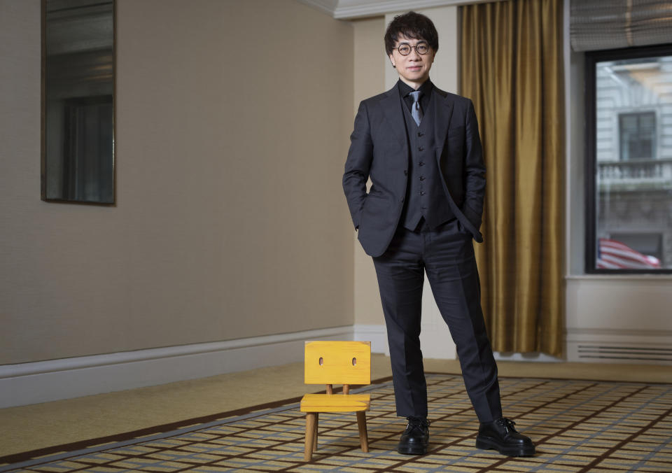 Makoto Shinkai poses for a portrait to promote the film "Suzume" on Tuesday, March 28, 2023 in New York. Shinkai was never the same filmmaker after the 2011 earthquake stuck Japan. His top three films since – "Your Name," "Weathering With You" and the new release "Suzume" -- have each tethered hugely emotional tales to ecological disaster. And they account for some of the biggest anime hits of all time. "Suzume" has already grossed more than $200 million. (Photo by Matt Licari/Invision/AP)