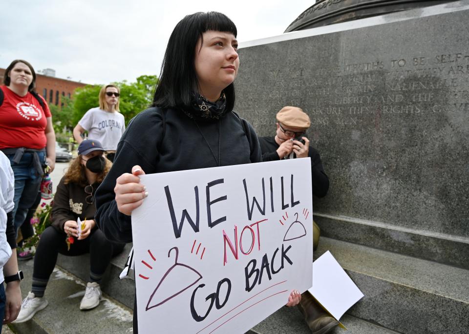 A abortion rights supporter listens to speakers during an abortion rights rally outside the Louisville Metro Hall, Wednesday, May. 04, 2022 in Louisville Ky.