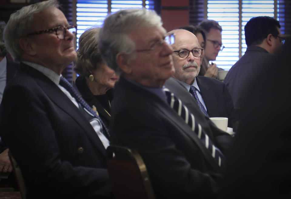 Associated Press photojournalist and Pulitzer Prize winner Richard Drew, center, a 2019 inductee into The Deadline Club Hall of Fame, sit with fellow inductees Tom Brokaw, far left, and Ted Koppel, third from left, during the award ceremony, Thursday Nov. 21, 2019, in New York. Drew, a staff photographer for AP in New York known for taking the The Falling Man photograph during the Sept. 11, 2001 attacks, is the first photojournalist to be inducted. (AP Photo/Bebeto Matthews)