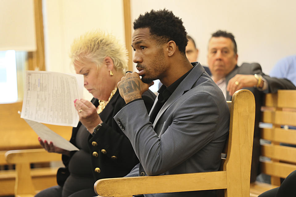 FILE - New England Patriots cornerback Jack Jones is seated at his arraignment on gun charges at East Boston Municipal Court, June 20, 2023, in Boston, Mass. Jones has agreed Tuesday, Sept. 5, to serve one year of probation and 48 hours of community service in exchange for prosecutors dropping eight of the nine weapons charges he faced in connection with his June arrest at a Boston Logan Airport security checkpoint for allegedly having two loaded guns in his carry-on bag. (Suzanne Kreiter/The Boston Globe via AP, Pool, File)