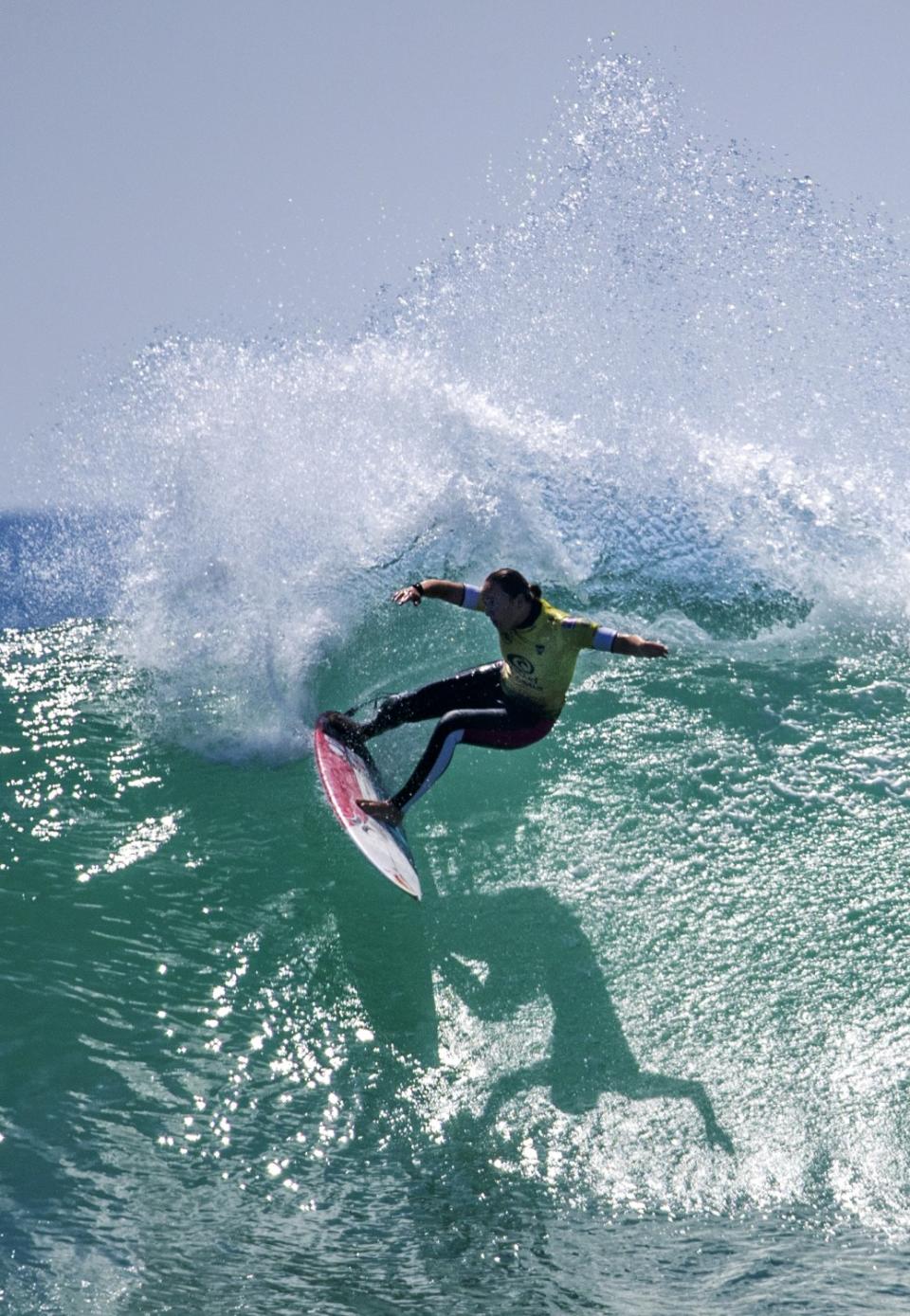 Carissa Moore turns off the top of a big wave against Tatiana Weston-Webb