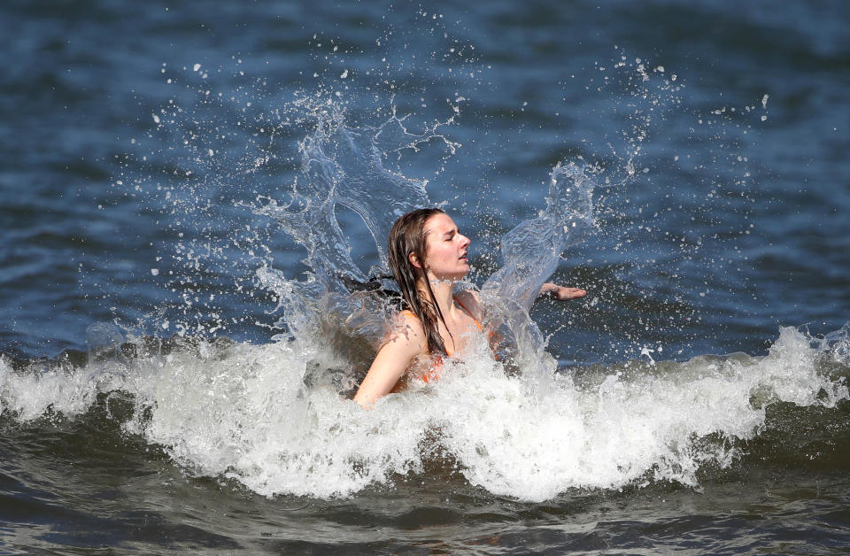 <p>People in the sea at Portobello beach, near Edinburgh, as Bank Holiday Monday could be the hottest day of the year so far - with temperatures predicted to hit 25C in parts of the UK. Picture date: Monday May 31, 2021.</p>
