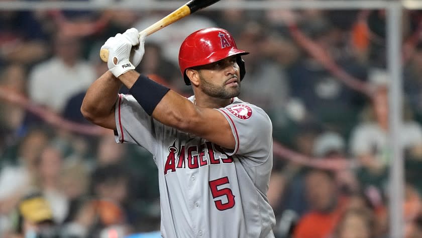 Los Angeles Angels' Albert Pujols bats against the Houston Astros during the eighth inning of a baseball game Friday, April 23, 2021, in Houston. (AP Photo/David J. Phillip)