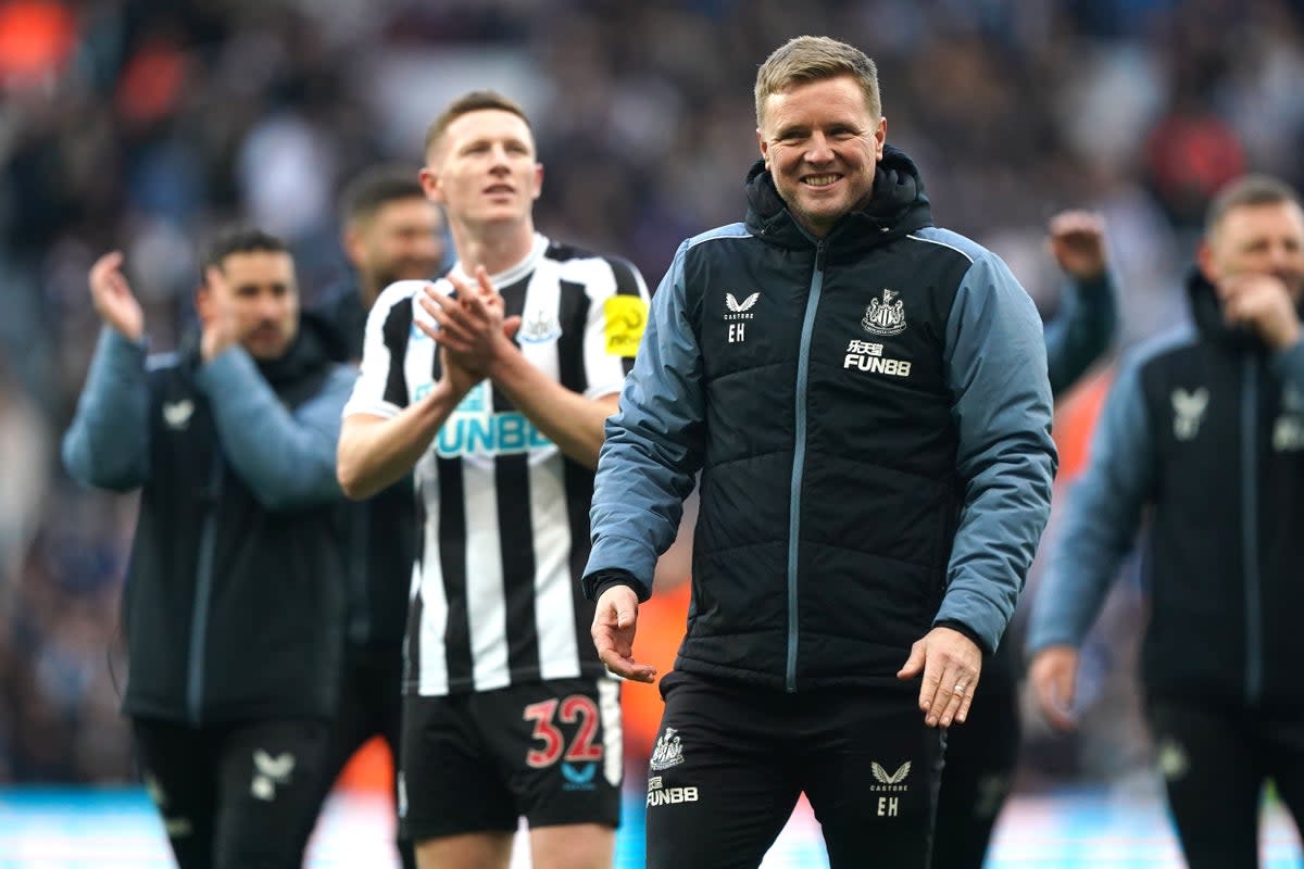 Newcastle United manager Eddie Howe and players celebrate after the final whistle in the Premier League match at St. James’ Park, Newcastle. Picture date: Sunday April 2, 2023. (PA Wire)