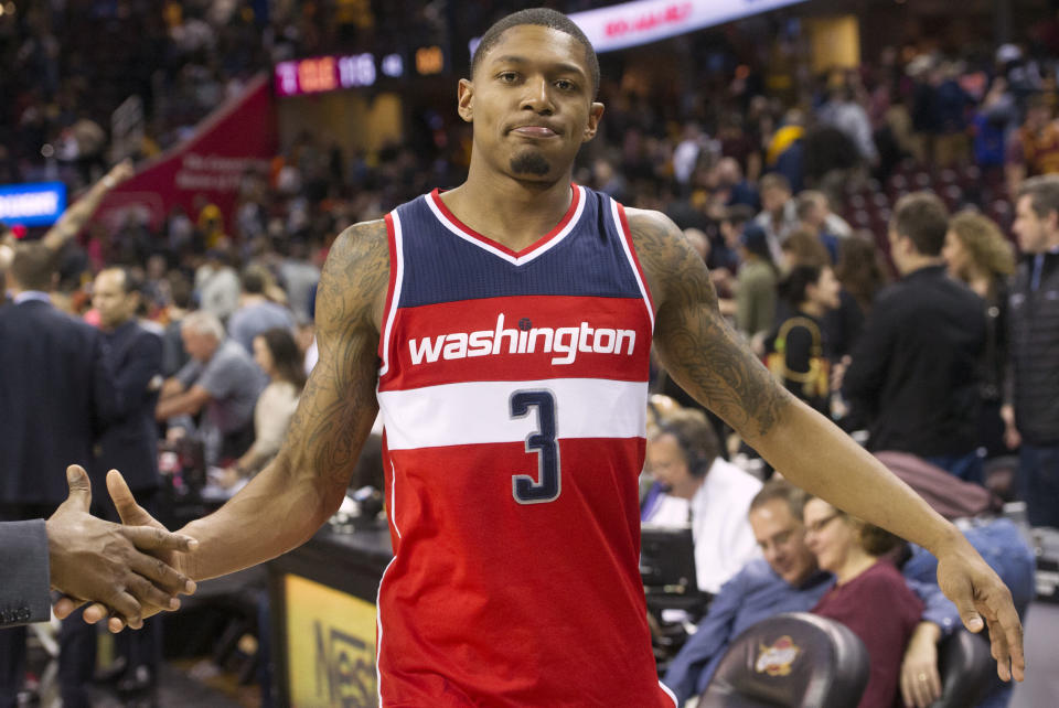 Washington Wizards' Bradley Beal (3) gets a handshake after the Wizards 127-115 win of an NBA basketball game over the Cleveland Cavaliers in Cleveland, Saturday, March 25, 2017. (AP Photo/Phil Long)