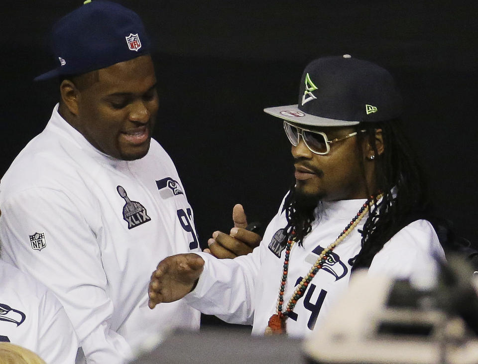 Brandon Mebane (L), in his Seahawks days with Marshawn Lynch in 2015, spoke out about housing discrimination. (AP) 