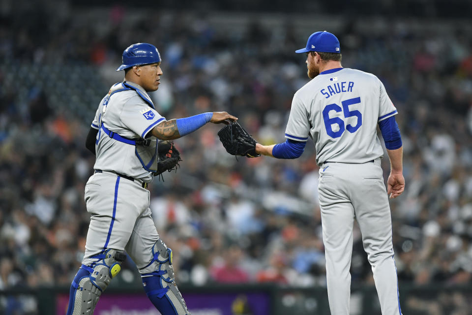 Kansas City Royals catcher Salvador Perez, left, gives the ball back to relief pitcher Matt Sauer during the ninth inning of the team's baseball game against the Detroit Tigers, Saturday, April 27, 2024, in Detroit. The Tigers won 6-5. (AP Photo/Jose Juarez)