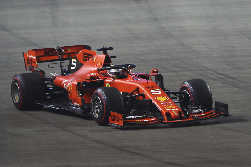 Ferrari driver Sebastian Vettel of Germany steers his car on the way to win the Singapore Formula One Grand Prix, at the Marina Bay City Circuit in Singapore, Sunday, Sept. 22, 2019. (AP Photo/Lim Yong Teck)