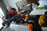 The team goes through their gear while in their hotel room in Punta Arenas.