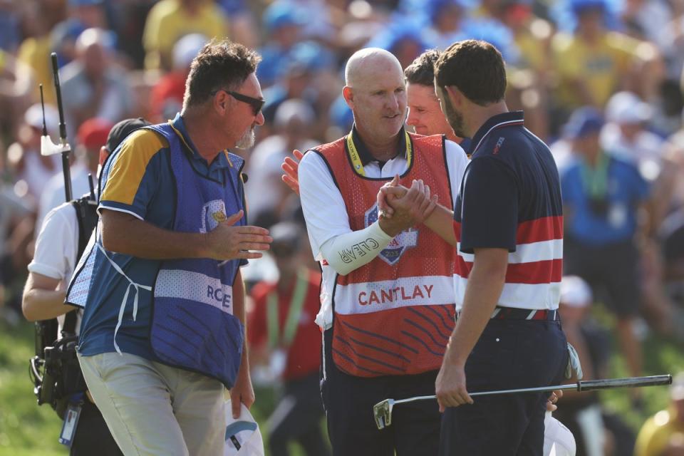 Patrick Cantlay shakes hands with caddie Joe Lacava (Getty)