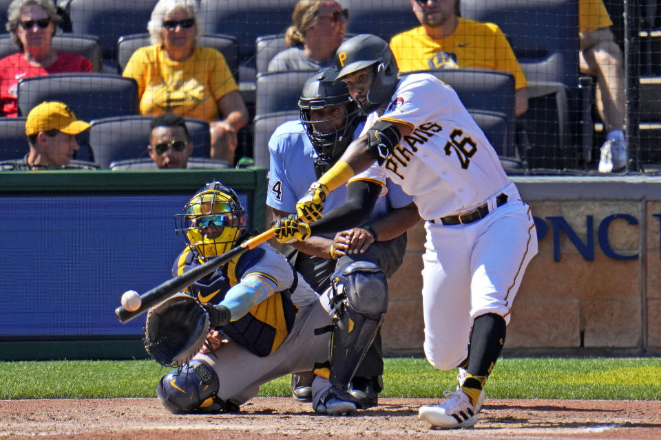 Pittsburgh Pirates' Miguel Andujar (26) singles off Milwaukee Brewers relief pitcher Hoby Milner, driving in a run, during the seventh inning of a baseball game against the Milwaukee Brewers in Pittsburgh, Wednesday, Sept. 6, 2023. (AP Photo/Gene J. Puskar)