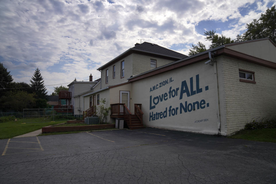 A suburban home converted into a mosque used by the Ahmadiyya Muslim community in Zion, Ill., on Saturday, Sept. 17, 2022. The Ahmadiyya Muslim community believes their founder, Mirza Ghulam Ahmad, defended their faith from Zion founder John Alexander Dowie's verbal attacks against Islam, and defeated him in a sensational prayer duel. A century after this historic challenge, the Ahmadi community has built their first official mosque in Zion. (AP Photo/Jessie Wardarski)