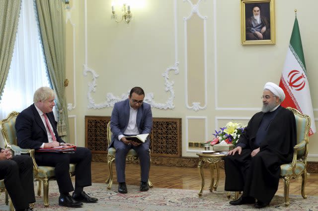 Iranian President Hassan Rouhani, right, meets Boris Johnson (Iranian Presidency Office via AP)