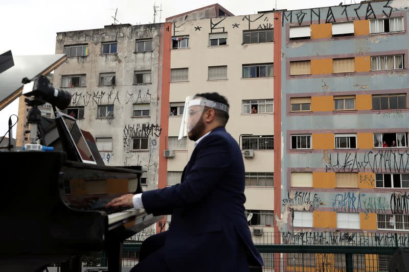 Pianist Rodrigo Cunha serenades from an open truck, in Sao Paulo