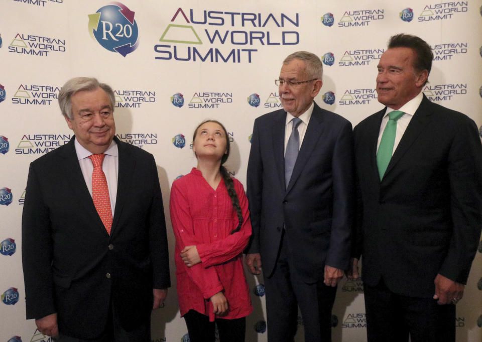 FILE - In this Tuesday, May 28, 2019 file photo United Nations Secretary-General Antonio Guterres, Swedish climate activist Greta Thunberg, Austrian President Alexander Van der Bellen and former California Gov. Arnold Schwarzenegger, from left, pose before the R20 Austrian world summit at Hofburg palace in Vienna, Austria. In a wide-ranging monologue on Swedish public radio, teenage climate activist Greta Thunberg recounts how world leaders queued up to have their picture taken with her even as they shied away from acknowledging the grim scientific fact that time is running out to curb global warming. (AP Photo/Ronald Zak, file)