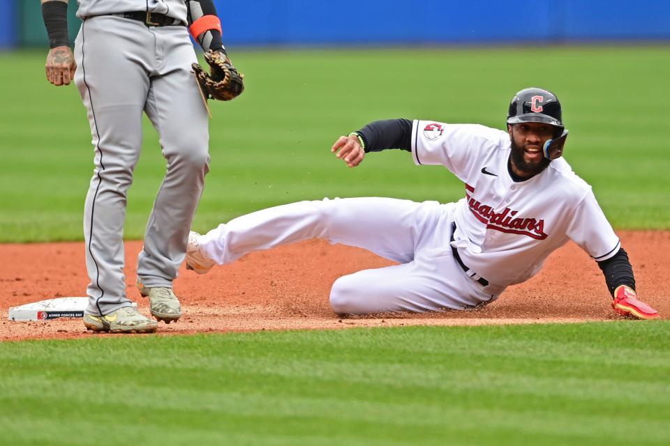 Cleveland Guardians' Amed Rosario steals second base in the first inning of a baseball game against the Detroit Tigers, Sunday, May 22, 2022, in Cleveland. (AP Photo/David Dermer)